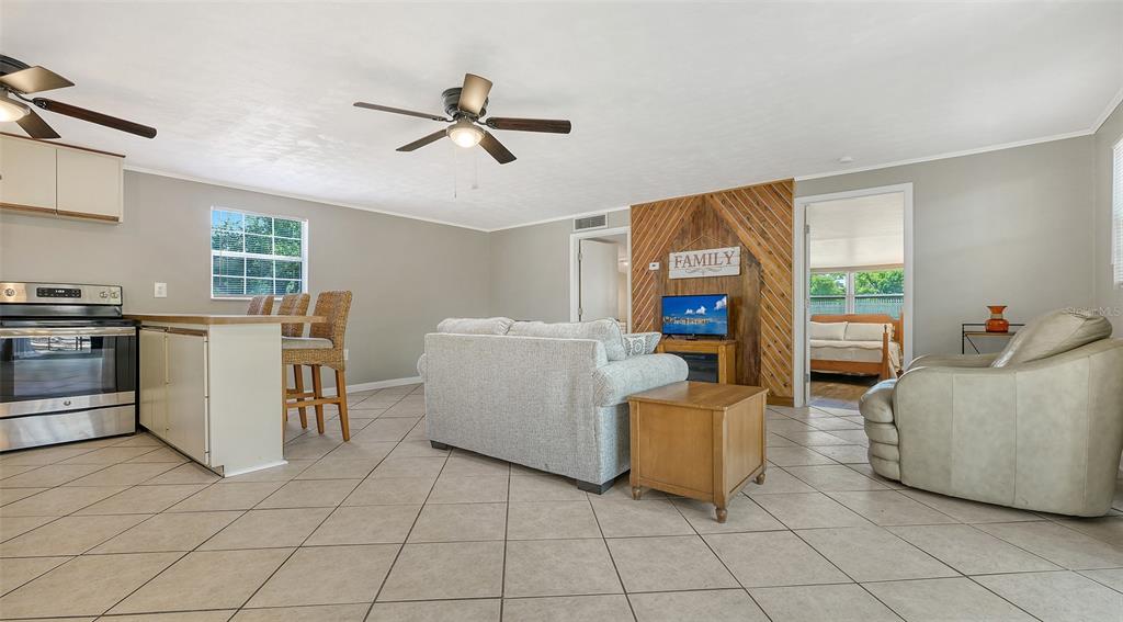 3818 Gocio Rd Extention Sarasota, FL 34235 - Photo 37 of 65 a living room with furniture and a fireplace