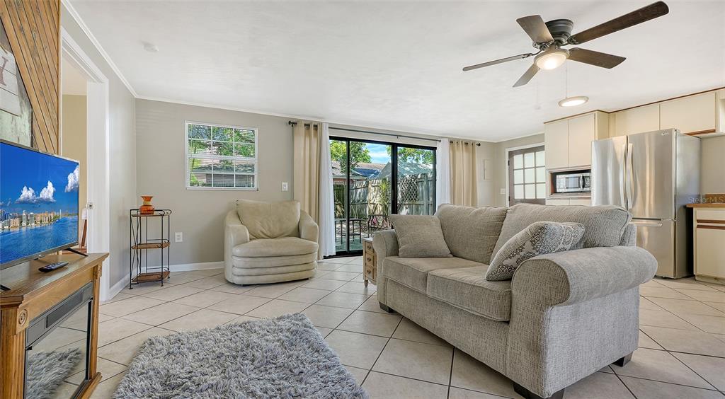3818 Gocio Rd Extention Sarasota, FL 34235 - Photo 39 of 65 a living room with furniture and a flat screen tv