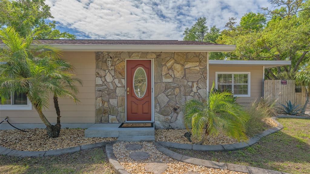 3818 Gocio Rd Extention Sarasota, FL 34235 - Photo 4 of 65 a view of a entryway that has a fountain