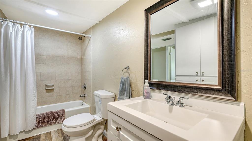 3818 Gocio Rd Extention Sarasota, FL 34235 - Photo 45 of 65 a bathroom with a sink toilet and shower