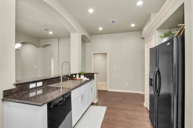 a bathroom with a sink double vanity and a mirror
