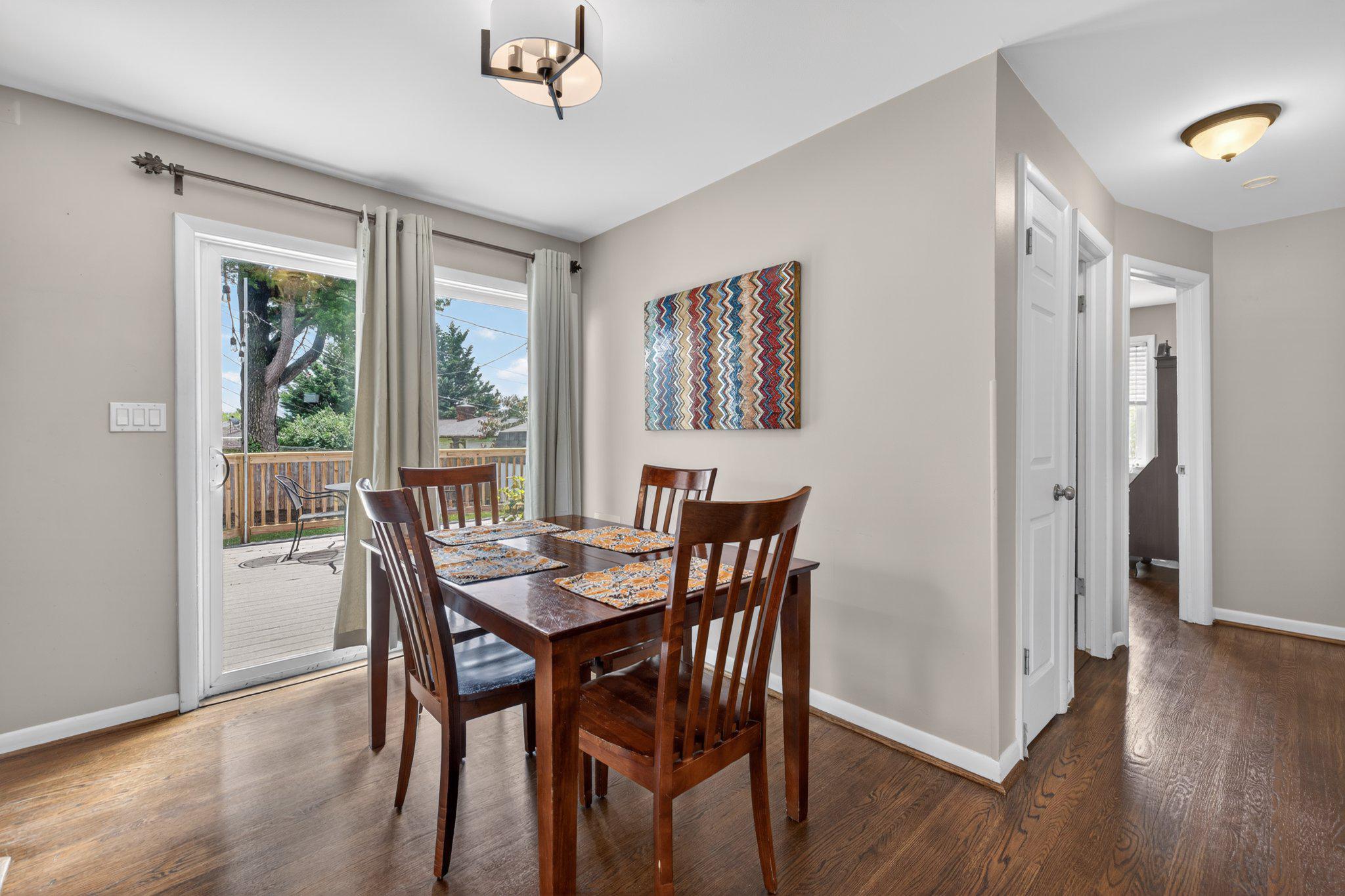 1002 Wilson Place Frederick, MD 21702 - Photo 8 of 30 a view of a dining room with furniture window and wooden floor
