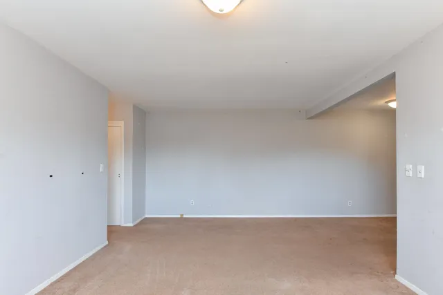 a view of livingroom and washer and dryer