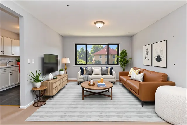a view of a room with a ceiling fan
