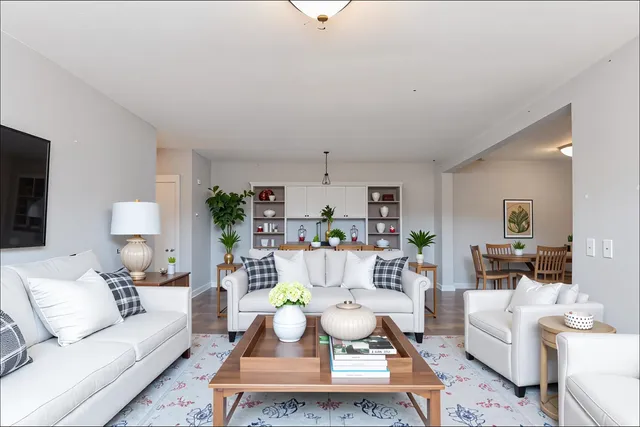 a view of a room with wooden floor and windows