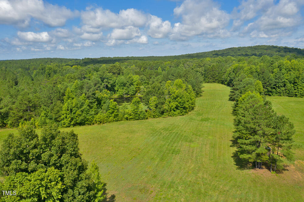 0 Range Road Stem, NC 27581 - Photo 4 of 35 a view of a lake with a yard