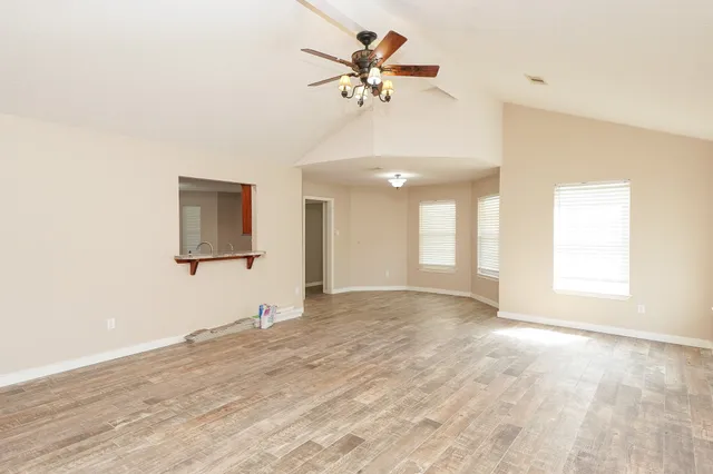 a view of an empty room with a window
