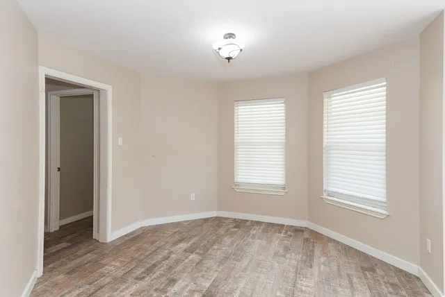 a view of an empty room with a window