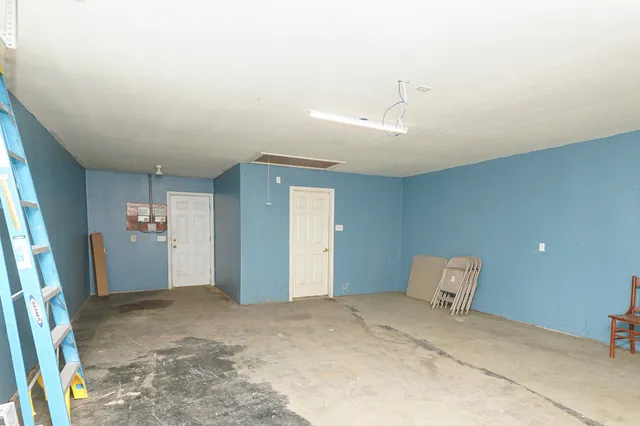 a view of a room with a large window