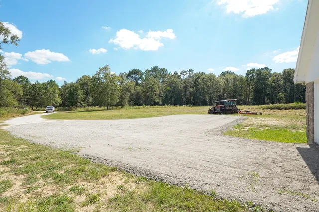 a view of a swimming pool with a yard