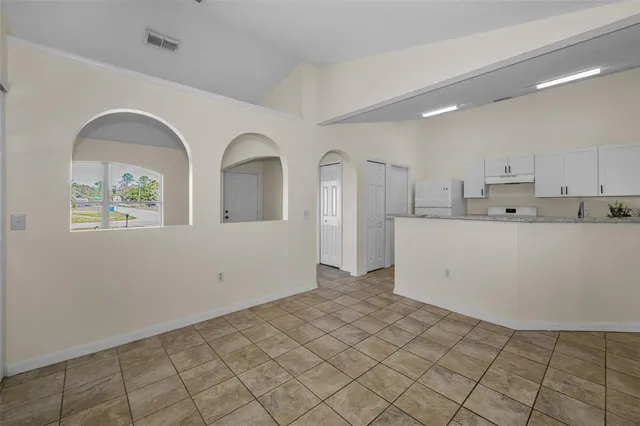 a view of a kitchen with electric appliances