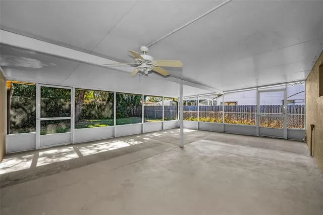 a view of empty room with floor to ceiling window