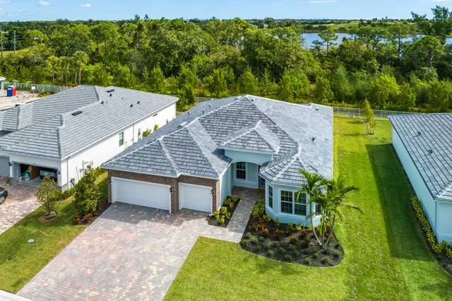 an aerial view of a house having swimming pool garden and patio