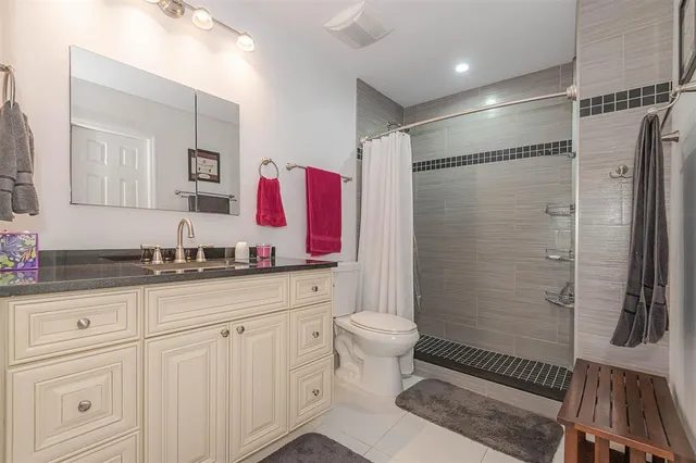 a car parked in front of a brick building