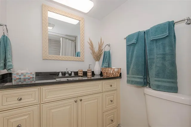 a patio with a table and chairs under an umbrella