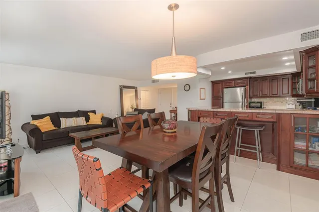 a view of a dining room with furniture window and outside view