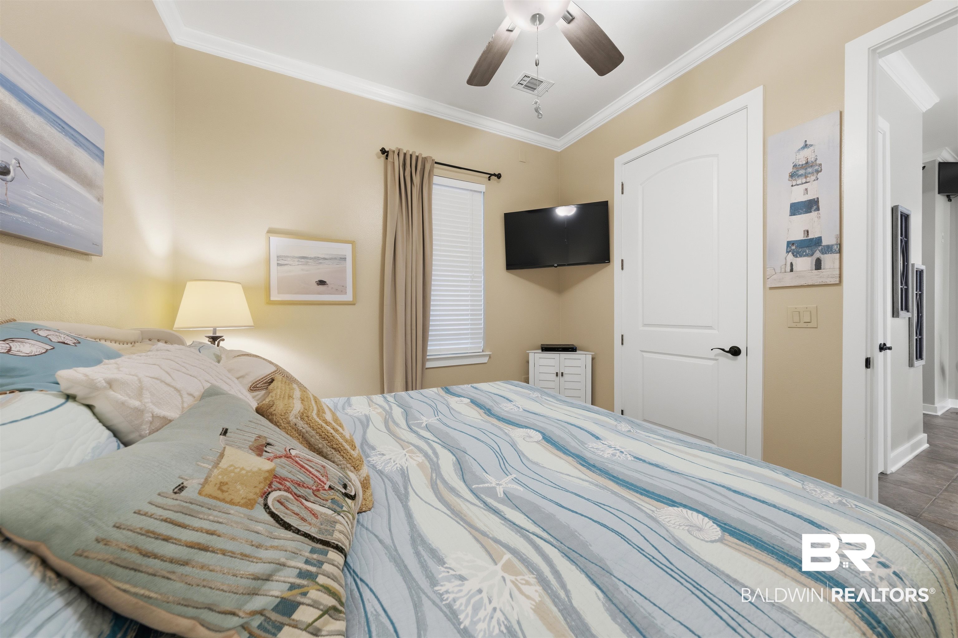 1430 Regency Road, Unit H202 Gulf Shores, AL 36542 - Photo 7 of 25 Bedroom featuring ornamental molding and ceiling fan