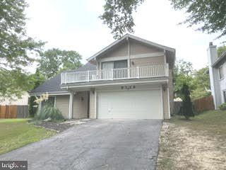 a house view with a outdoor space