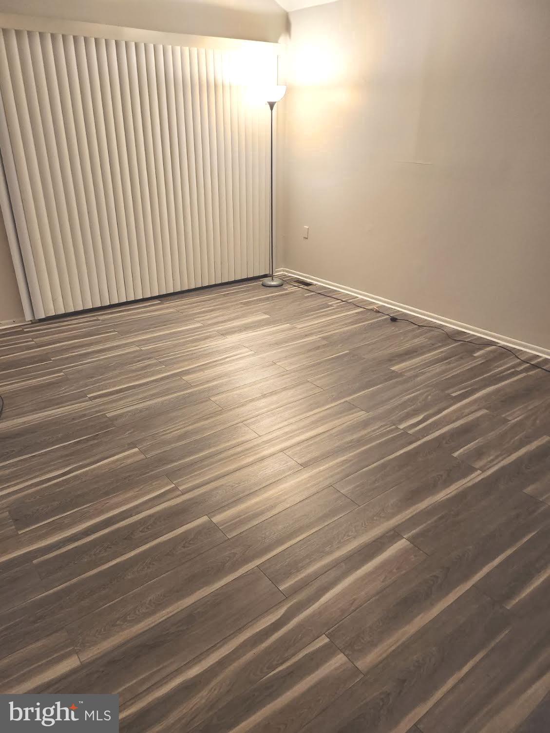 9129 Tulip Grove Road Gaithersburg, MD 20879 - Photo 11 of 23 a view of a room with wooden floor