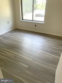 9129 Tulip Grove Road Gaithersburg, MD 20879 - Photo 17 of 23 an empty room with wooden floor and windows
