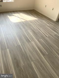 9129 Tulip Grove Road Gaithersburg, MD 20879 - Photo 20 of 23 a view of an empty room with wooden floor