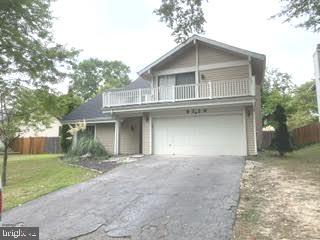 9129 Tulip Grove Road Gaithersburg, MD 20879 - Photo 2 of 23 a view of a house with a yard