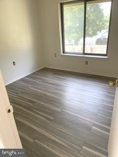 9129 Tulip Grove Road Gaithersburg, MD 20879 - Photo 21 of 23 an empty room with wooden floor and windows
