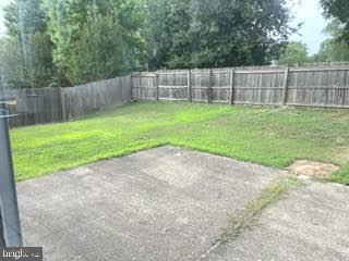 9129 Tulip Grove Road Gaithersburg, MD 20879 - Photo 23 of 23 a backyard of a house with a small yard and large trees