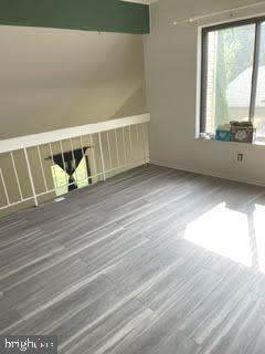 9129 Tulip Grove Road Gaithersburg, MD 20879 - Photo 7 of 23 a view of wooden floor and windows in a room