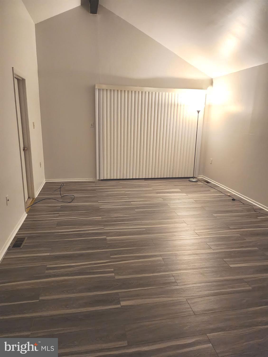 9129 Tulip Grove Road Gaithersburg, MD 20879 - Photo 10 of 23 a view of an empty room with wooden floor