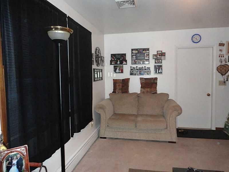 175 Bryson Road Butler, PA 16001 - Photo 3 of 13 Living Room. THE LIVING ROOM HAS CONVENIENT ACCESS TO BOTH THE FRONT AND THE GARAGE DOORS.