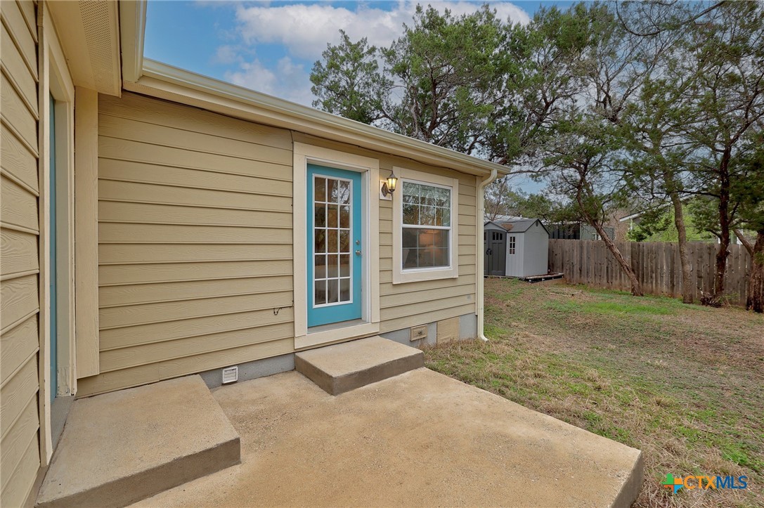 4607 Cedar Point Drive Austin, TX 78723 - Photo 18 of 27 a view of house with backyard and trees