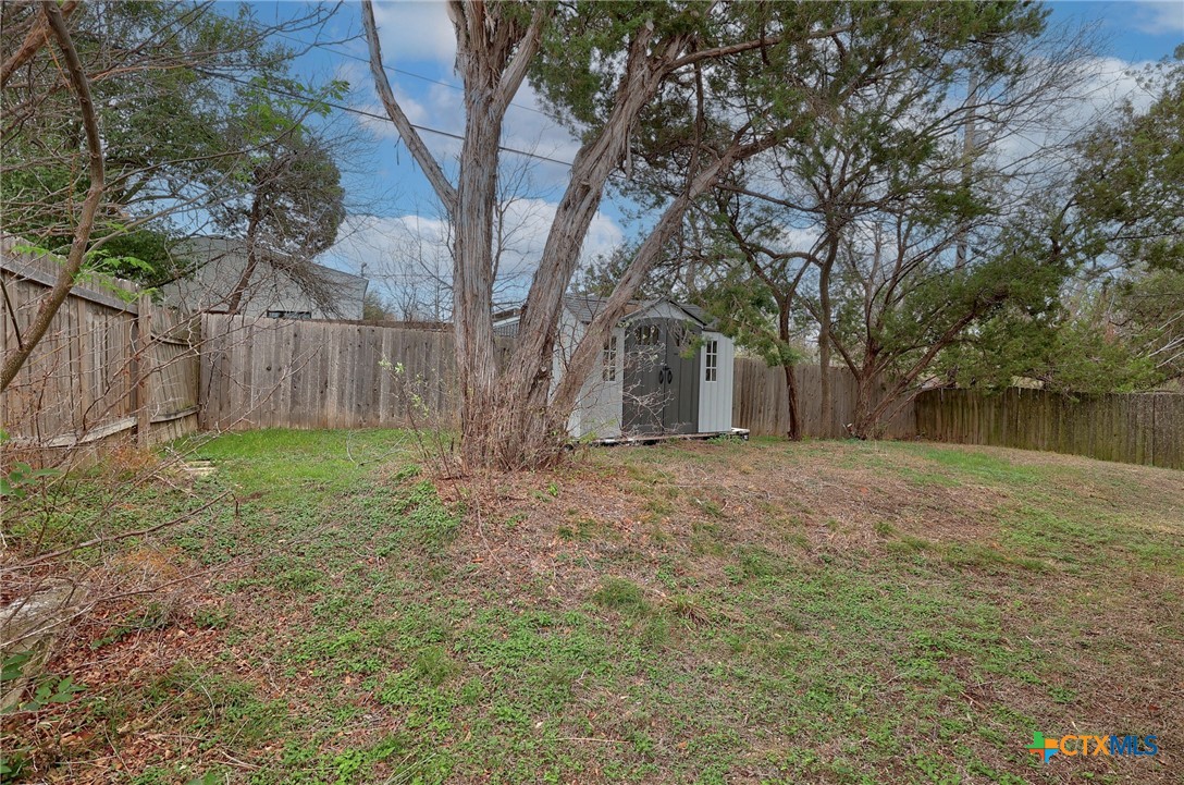 4607 Cedar Point Drive Austin, TX 78723 - Photo 20 of 27 a view of a yard with tree s