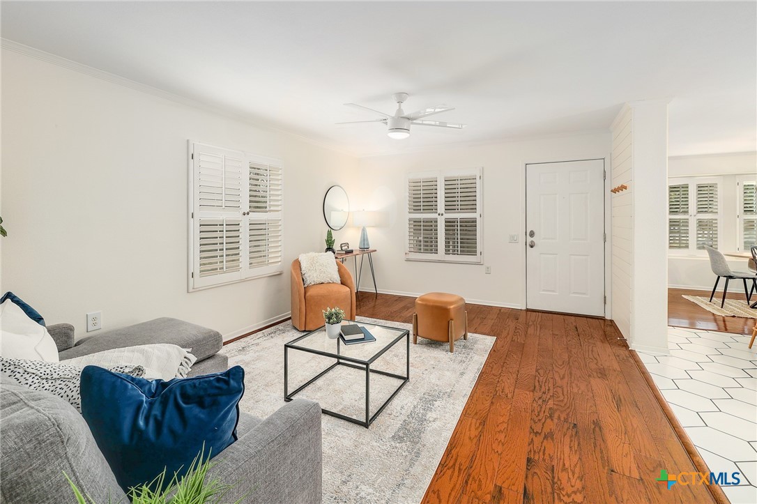 4607 Cedar Point Drive Austin, TX 78723 - Photo 2 of 27 a living room with furniture and a wooden floor
