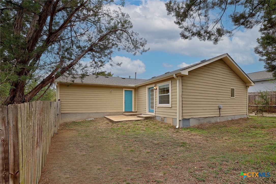 4607 Cedar Point Drive Austin, TX 78723 - Photo 21 of 27 a view of a house with a yard and garage