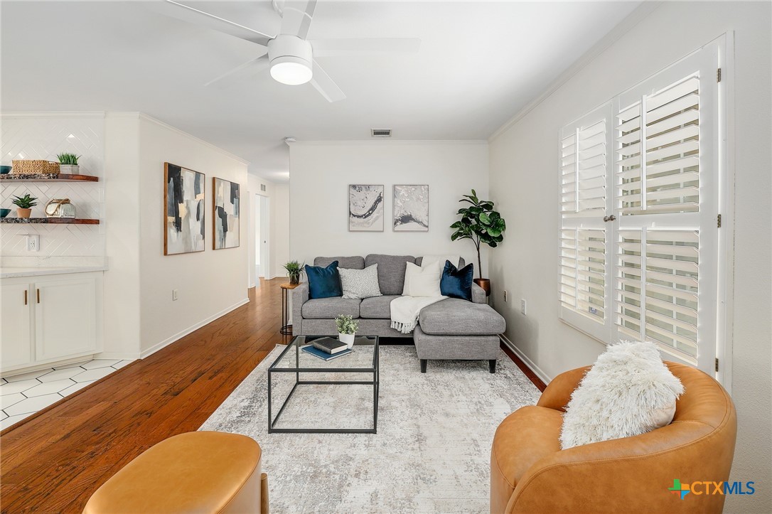 4607 Cedar Point Drive Austin, TX 78723 - Photo 4 of 27 a living room with furniture potted plant and a window