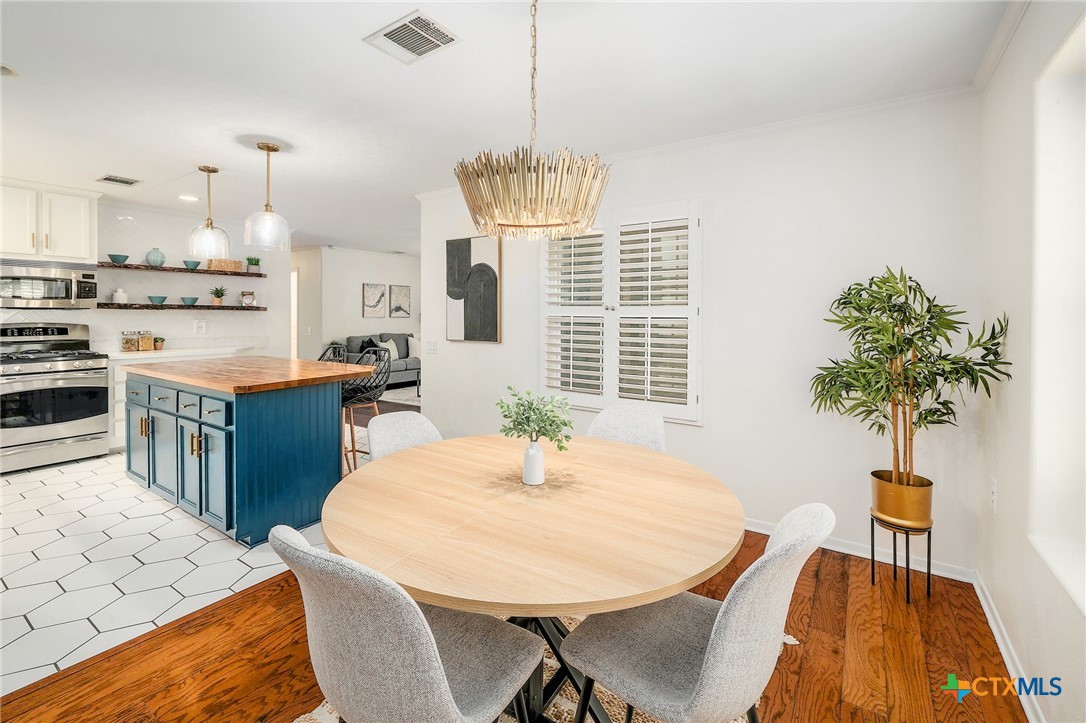 4607 Cedar Point Drive Austin, TX 78723 - Photo 6 of 27 a dining room with furniture and window