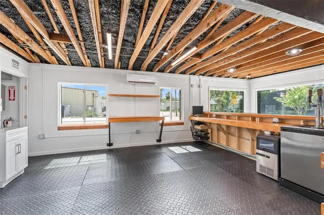 a kitchen with stainless steel appliances a large counter top