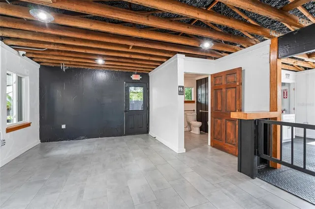 a spacious bathroom with a large window