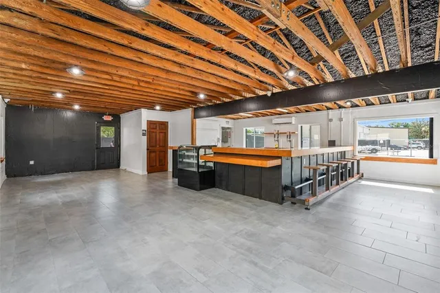 a large swimming pool with a table and chairs