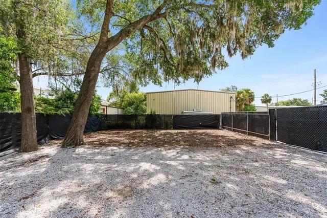 a backyard of a house with lots of green space