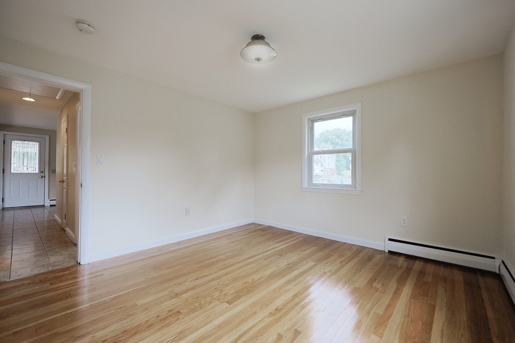 8 Greenwood Road Ashland, MA 01721 - Photo 16 of 29 a view of empty room with wooden floor and fan