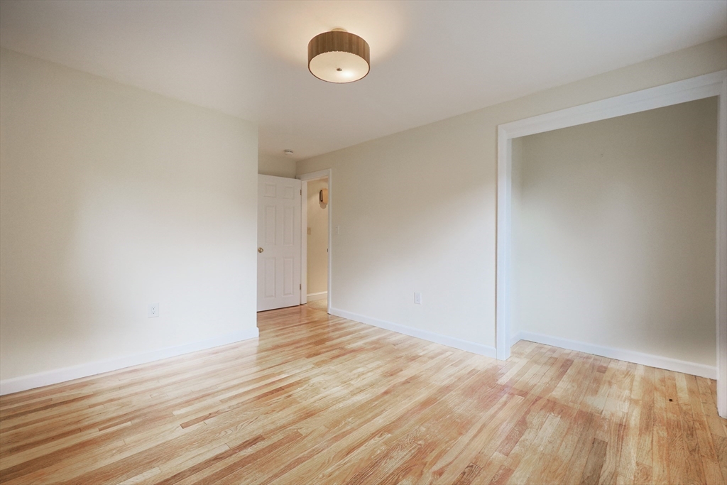 8 Greenwood Road Ashland, MA 01721 - Photo 20 of 29 a view of an empty room with wooden floor