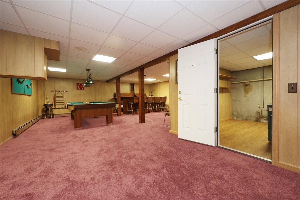 8 Greenwood Road Ashland, MA 01721 - Photo 23 of 29 a swimming pool with a large window and furniture