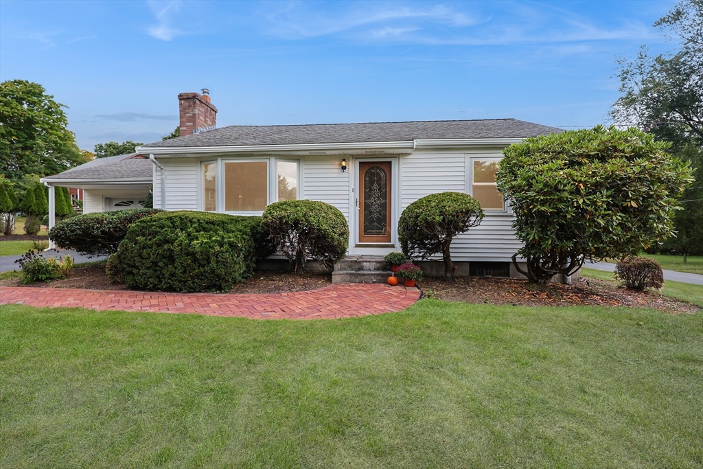 8 Greenwood Road Ashland, MA 01721 - Photo 3 of 29 front view of a house with potted plants and a yard