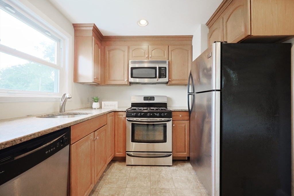 8 Greenwood Road Ashland, MA 01721 - Photo 10 of 29 a kitchen with a sink stove and microwave