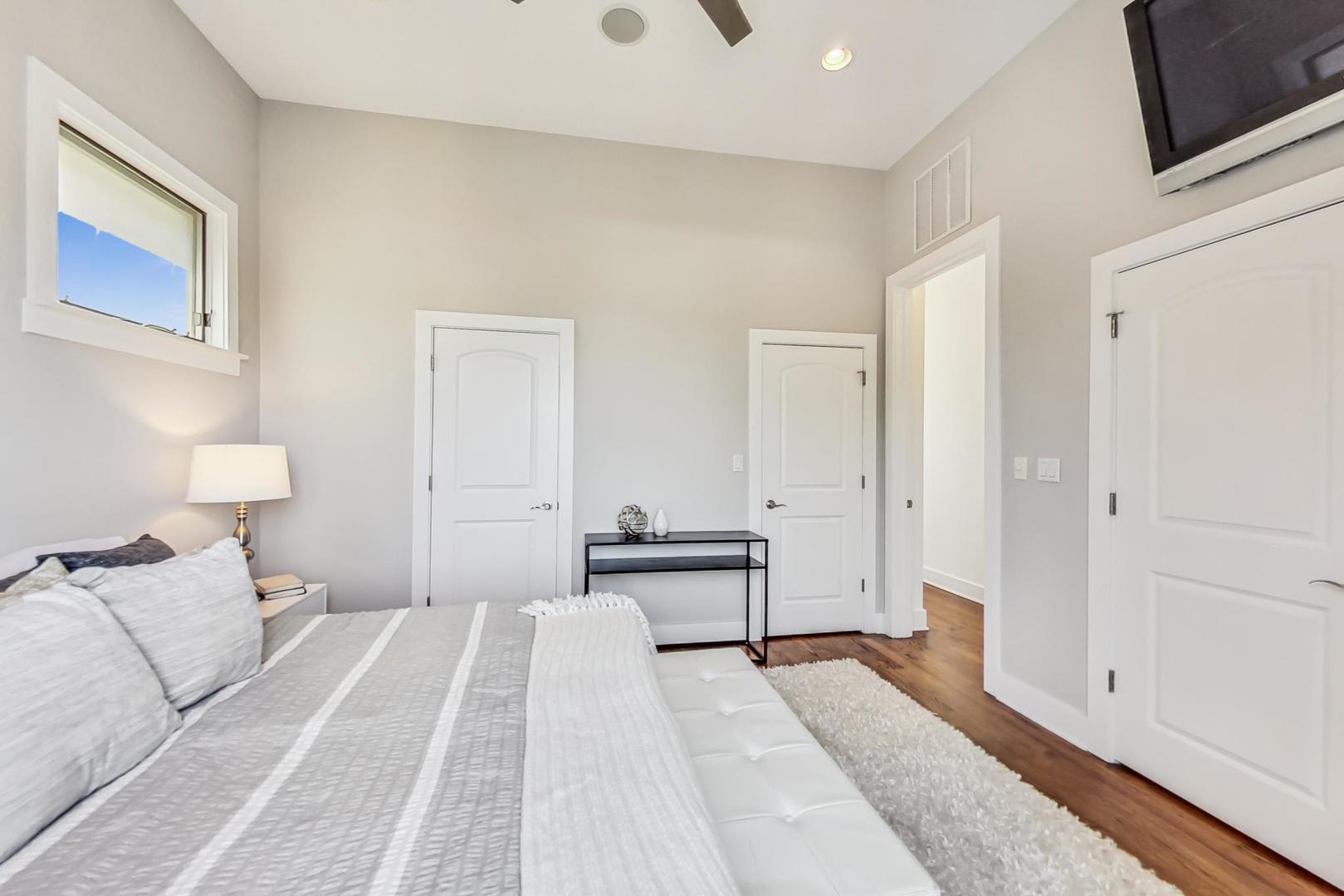 2035 North Leavitt Street, Unit 2 Chicago, IL 60647 - Photo 12 of 44 a bedroom with a bed and a night stand