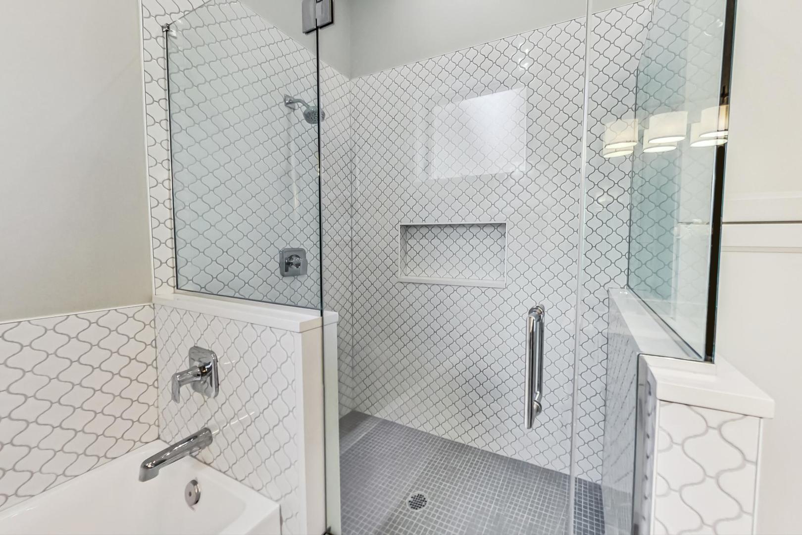 2035 North Leavitt Street, Unit 2 Chicago, IL 60647 - Photo 14 of 44 a bathroom with a bathtub and shower