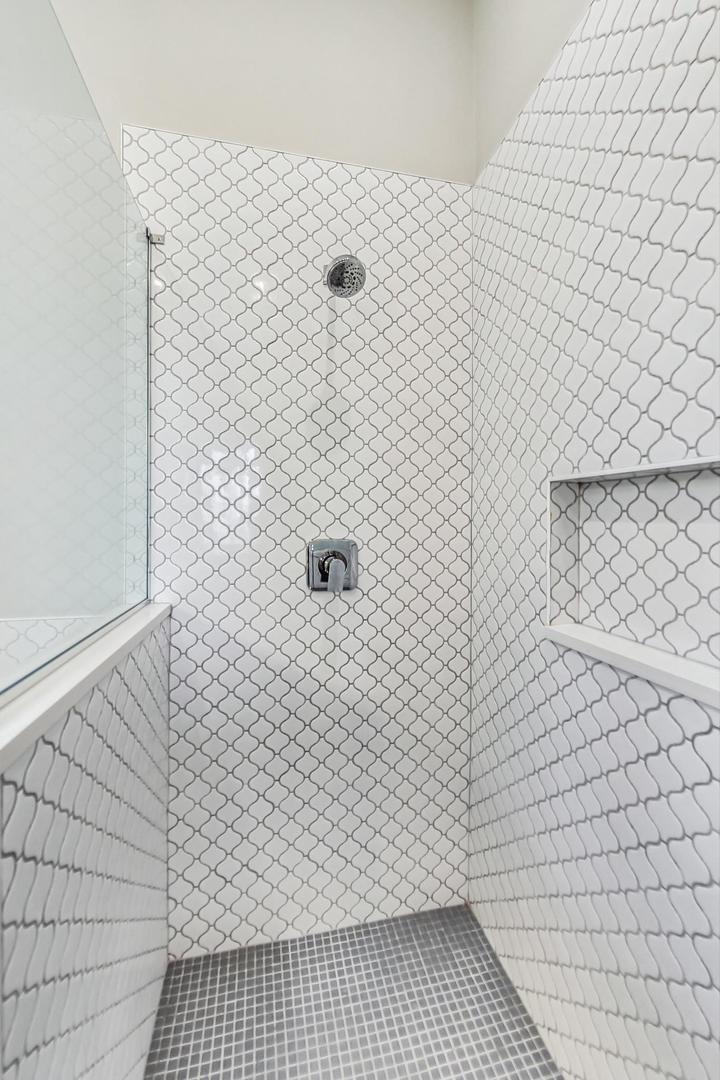 2035 North Leavitt Street, Unit 2 Chicago, IL 60647 - Photo 15 of 44 a bathroom with a white wall