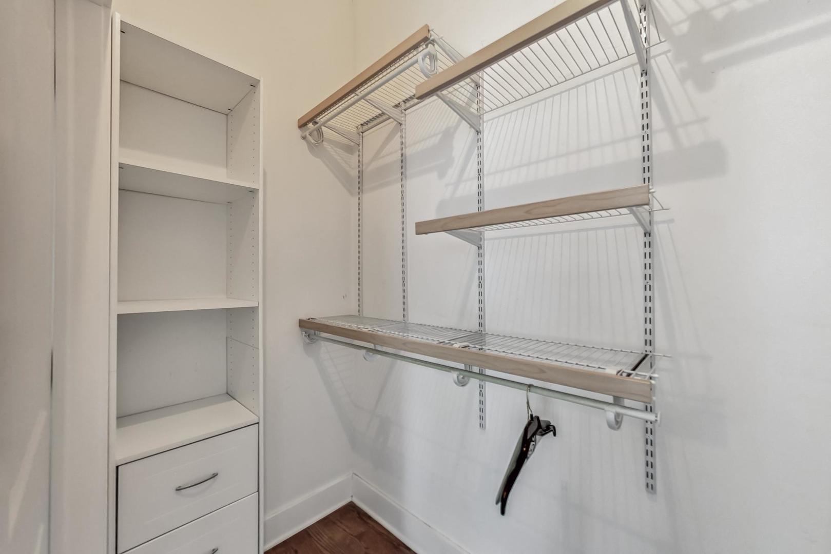 2035 North Leavitt Street, Unit 2 Chicago, IL 60647 - Photo 16 of 44 a view of walk in closet with empty racks